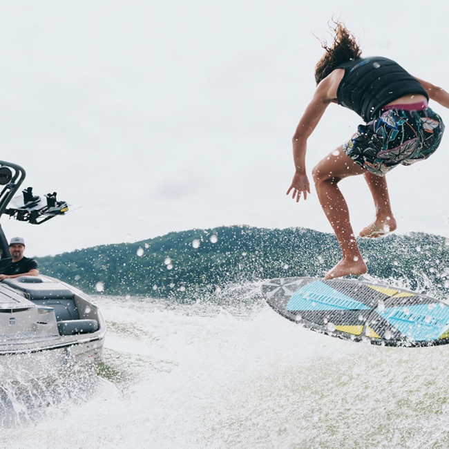 Surfer flipping on a wake