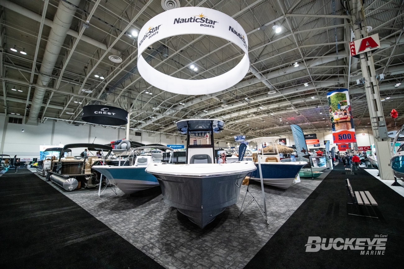 dramatic wide angle shot of three center console boats from nauticstar at the toronto international boat show