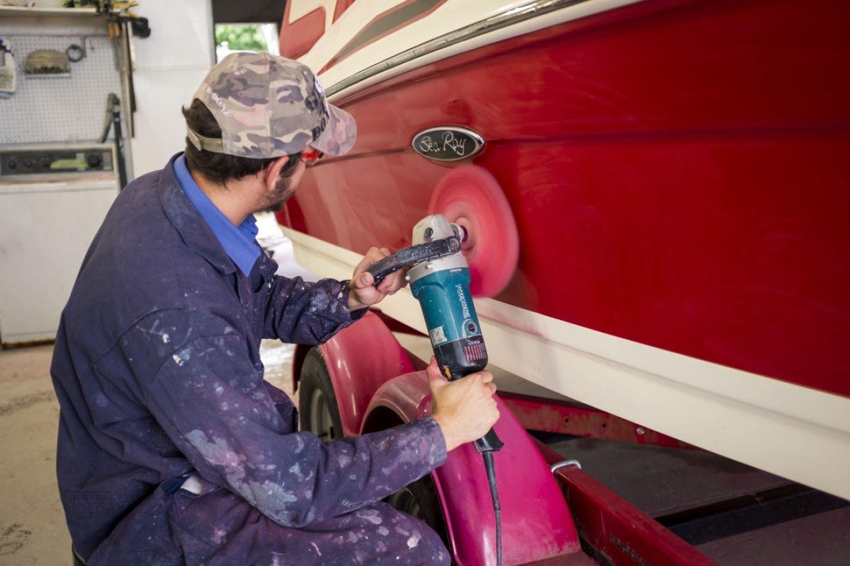 Buffing a red boat