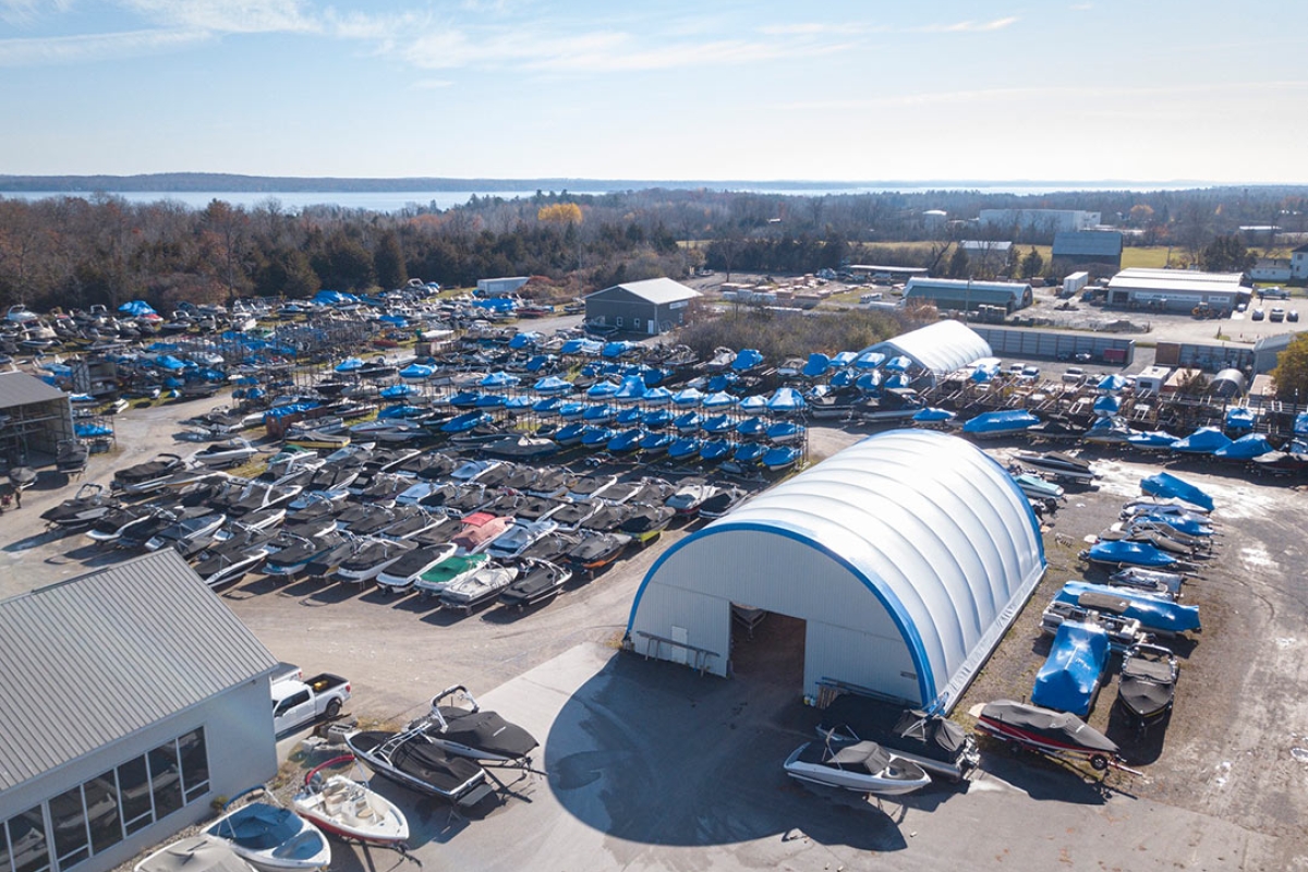 Quonset hut in late fall with boats ready for wrapping