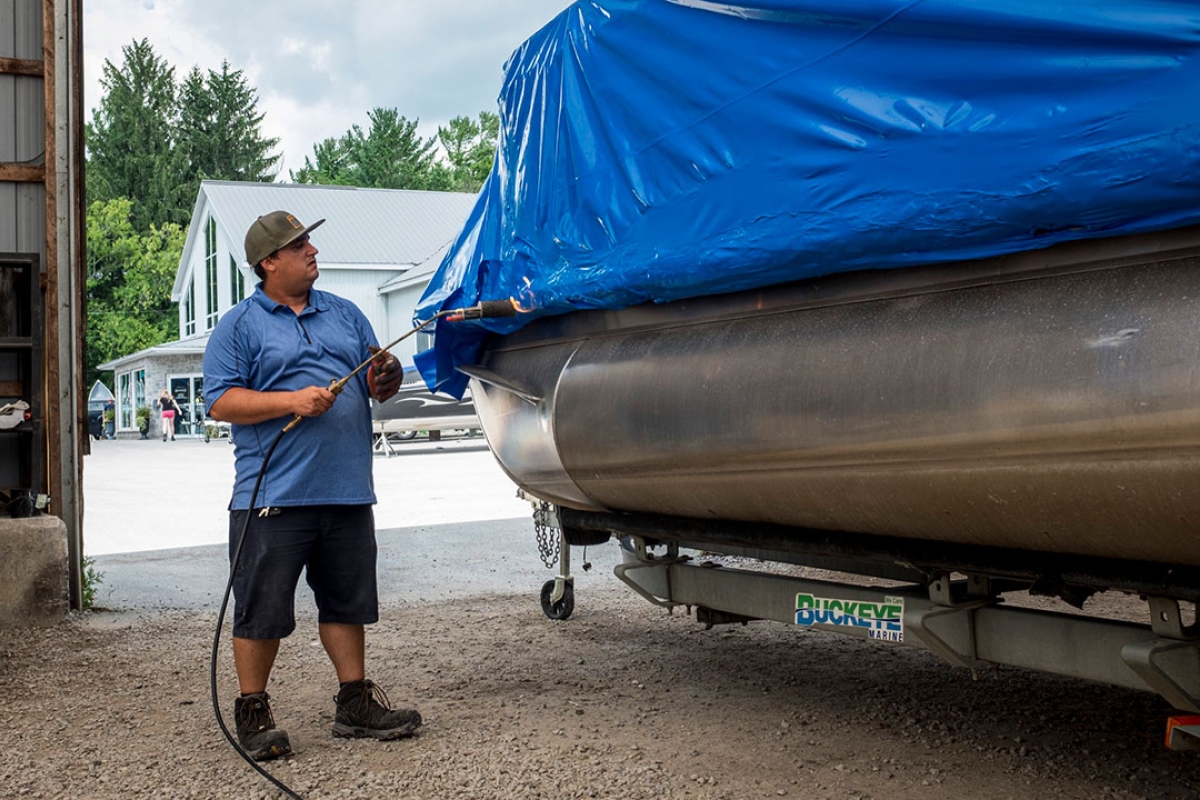 Shrink wrapping a pontoon with a propane torch